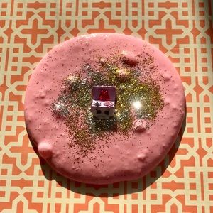 Pink stretchy slime with multi-colored glitter